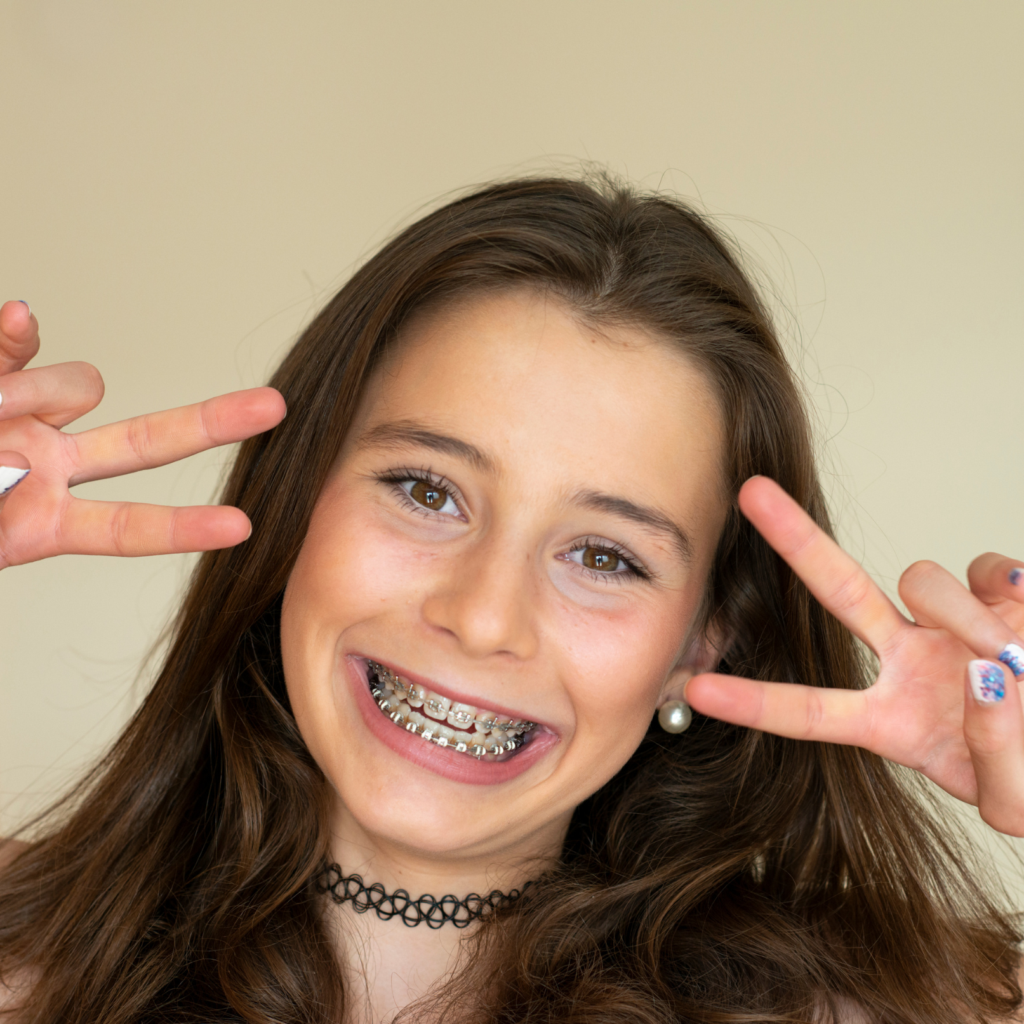 Girl smiling wearing braces