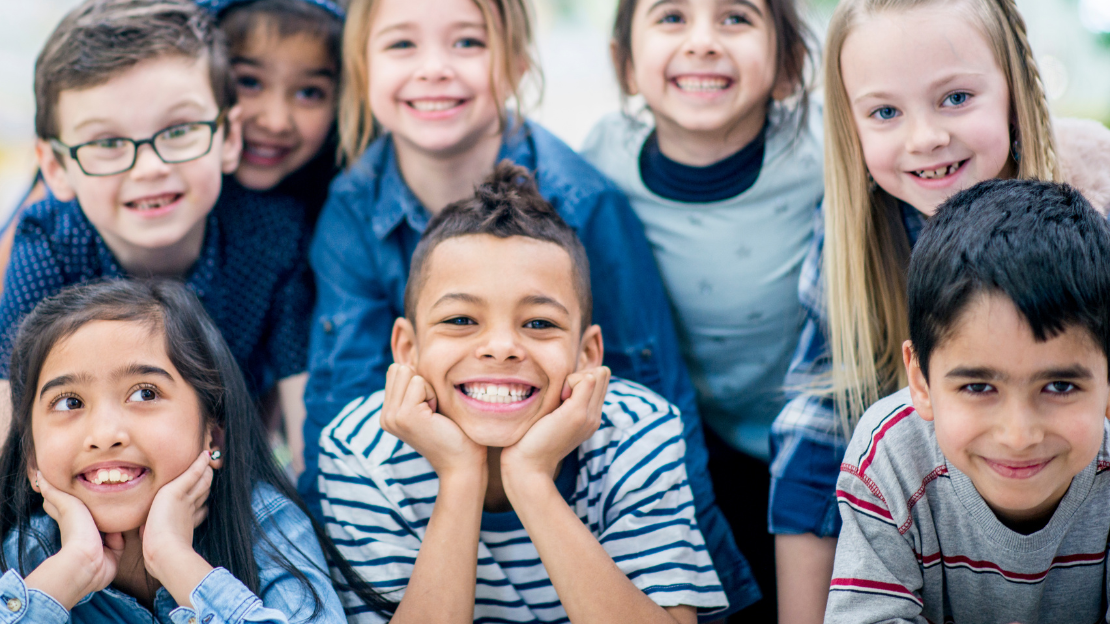 Group of smiling children with healthy teeth posing together